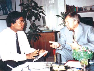 Charge the Affairs of Switzerland in Bangladesh Mr. Juerg Casserini is sharing information on Swiss educational system with Campus Editor (2002) 