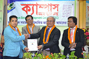 Managing Director of Ansar-VDP Development Bank, Md. Shams-Ul Islam is giving Certificates to the Trainees of Free Computer Training (Batch 134) as Chief Guest; Secretary-General of CSDC, Dr. M Helal, is presiding over. (2015)