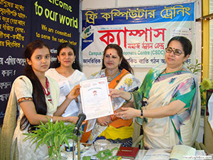 Advisor of Former Caretaker Government Mrs. Rasheda K Chowdhury and Ward Commissioner Mrs. Shirin Rukhsana is giving Certificates to the Trainees of Free Computer Training (Batch 110); Dr. M Helal is presiding over. (2011)