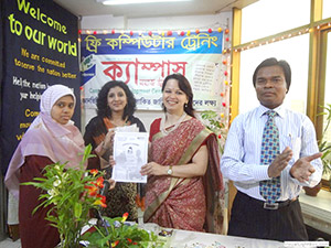 Laser Treatment Specialist Dr. Jhumu Khan is giving Certificates to the Trainees of Free Computer Training (Batch 118) as Chief Guest; Dr. M Helal is presiding over. (2013)