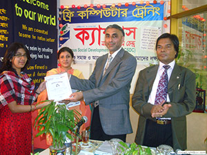 Founder of GMG Airlines Mr. Shahab Sattar is giving Certificates to the Trainees of Free Computer Training (Batch 89) as Chief Guest; Dr. M Helal is presiding over. (2009)