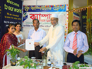 Chairman of Eastern University, Mr. Anwar Hossain Chowdhury and Eminent Professor of Dhaka University, and Professor Dr. Khalilur Rahman are giving Certificates to the Trainees of Free Computer Training (Batch 113); Dr. M Helal is presiding over. (2011)