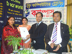 Secretary of Cultural Ministry Mr. Hedayetullah Al Mamun is giving Certificates to the Trainees of Free Computer Training (Batch 96) as Chief Guest; Dr. M Helal is presiding over. (2009)