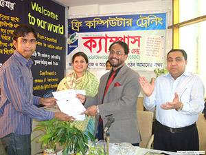 Hon. Minister for Civil Aviation & Tourism Mr. G M Qader is giving Certificates to the Trainees of Free Computer Training (Batch 99) as Chief Guest; Dr. M Helal is presiding over. (2010)