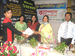 Founder of Bangladesh Women Entrepreneurs Associate, Nasrin Awal Mintu and Founder of Persona, Kanij Almas Khan, are giving Certificates to the Trainees of Free Computer Training (Batch 75); Dr. M Helal is presiding over. (2008)