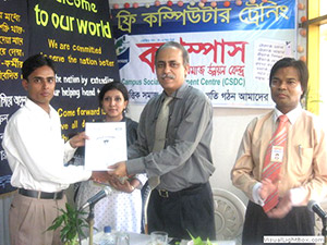 President of REHAB, Engr. Tanvirul Haque is giving Certificates to the Trainees of Free Computer Training (Batch 68) as Chief Guest; Dr. M Helal is presiding over. (2008)