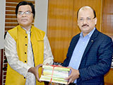 Dr. M Helal is handing over Creative Books and Models of Campus Publications to EX-MP MA Awal. (2018)