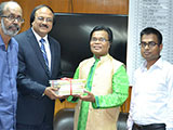 Dr. M Helal is handing over Creative Books and Models of Campus Publications to Chairman of NBR, Nojibur Rahman. (2014)