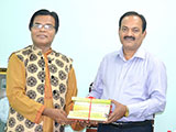 Dr. M Helal is handing over Creative Books and Models of Campus Publications to Chairman of NCTB, Professor Narayan Chondro Saha (2018)