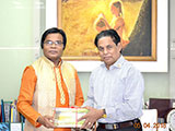 Dr. M Helal is handing over Creative Books and Models of Campus Publications to Poet Sheikh Robiul Haque (2018)